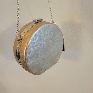 BRAND NEW WITH TAG ON HARD CLUTCH BY KAARI BLUE.6.1/2" TALL 6.1/2"WIDE 2" DEEP W